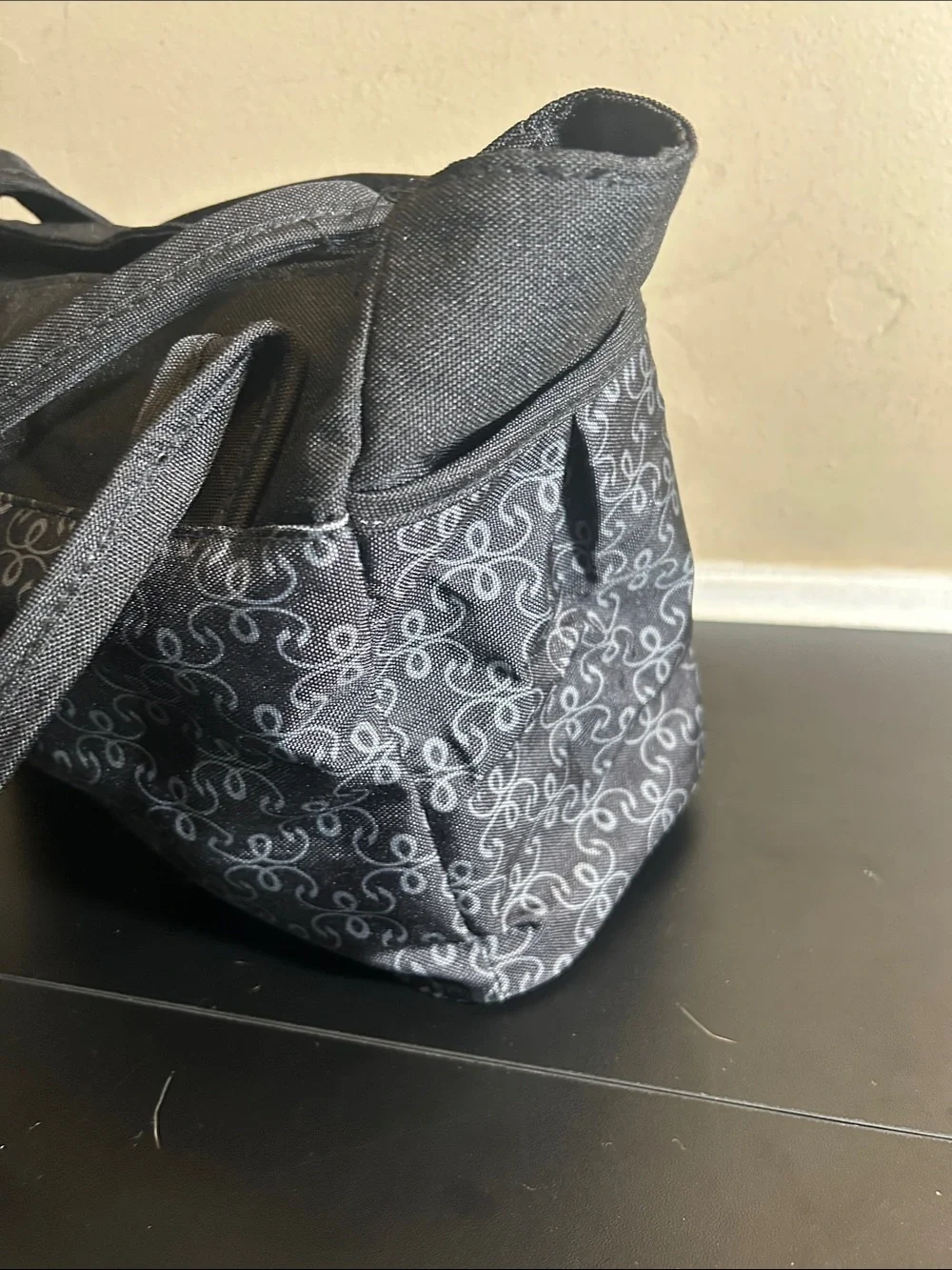 The First Years black and grey patterned canvas diaper bag tote